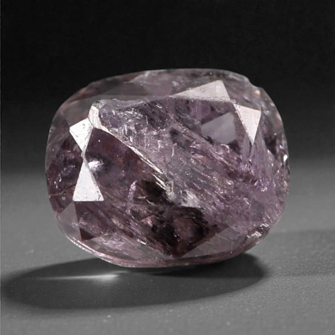 0.29 Carats Purplish Pink Diamond - Natural Argyle Mine, Australia, 94A: This singular purplish pink diamond from the Argyle mine is a rare and captivating gem, showcasing the distinctive, velvety hue that has made Australian pink diamonds among the most coveted in the wor