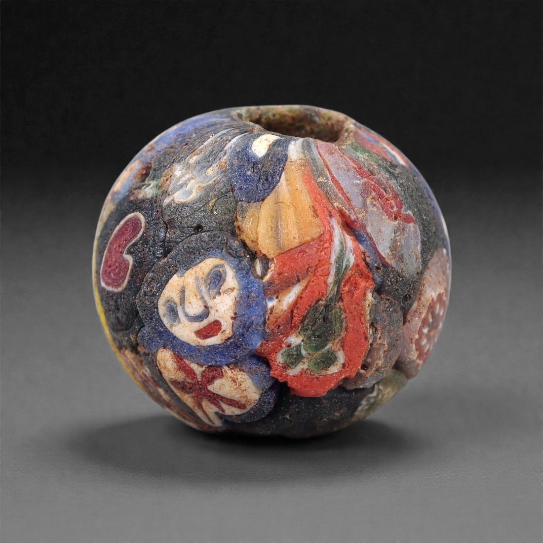 Antique Glass Bead - Venetian Scramble Cane Sphere, 32Z: Composed of dense polychrome glass, this spherical bead is formed using the Venetian scramble cane technique, characterized by irregularly arranged sections of multicolored glass canes fused into a si