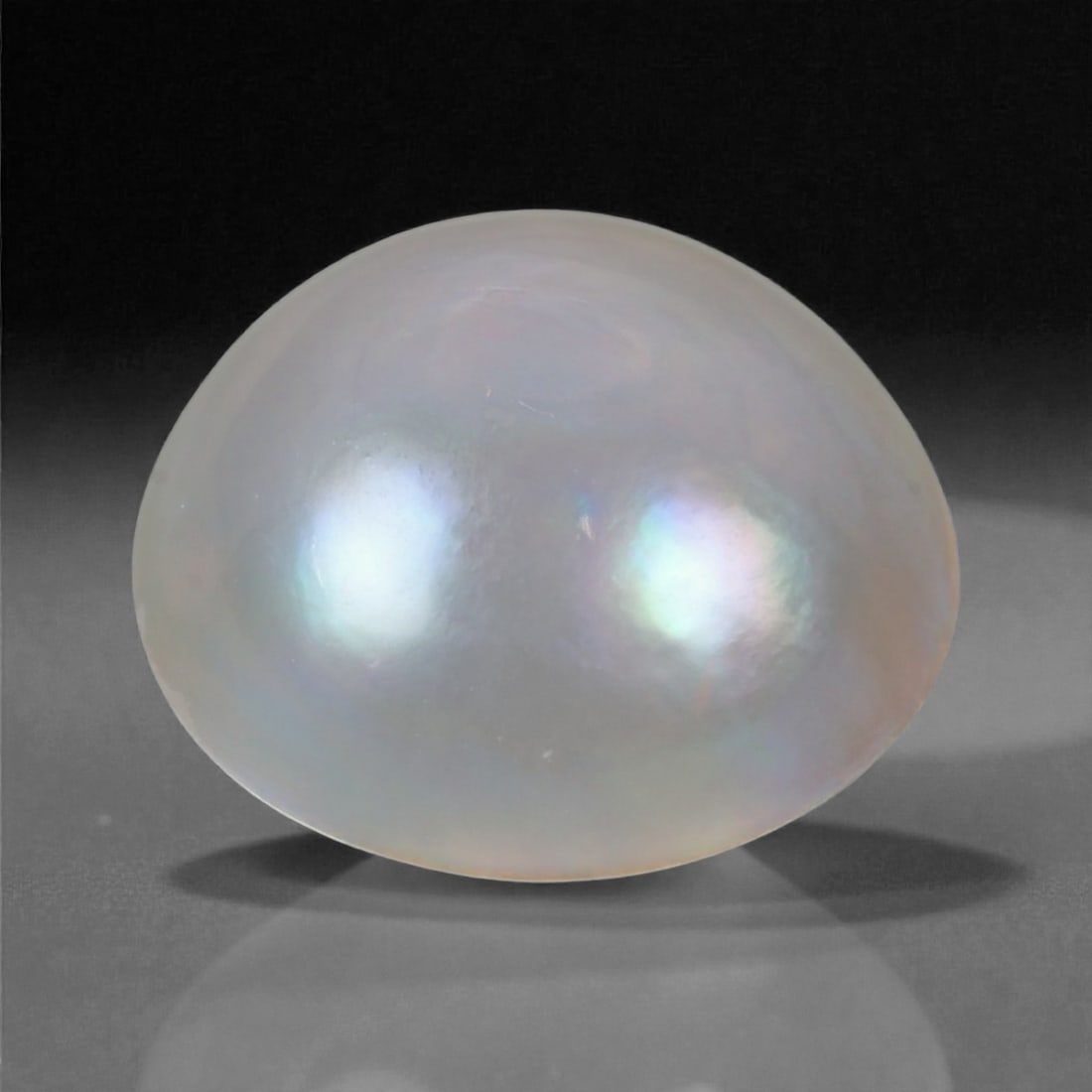6.75 Carats Silvery Lavender Baroque Pearl - Natural Cultured Gem - 14 mm, 15WE: This exquisite baroque pearl exhibits a soft silvery lavender body color with graceful overtones of blue, rose, and green that shimmer across its surface. Its organic, non-round silhouette adds charac