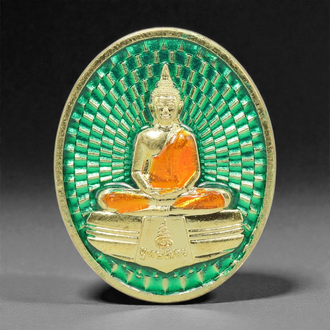 A Thai Gilt-Metal Buddha Medallion, 21st Century, 66FP: Cast from metal with a gilt surface finish, the medallion is circular and double-sided with a raised gilt border. The obverse features a gilt figure of the Buddha seated in cross-legged meditation pos
