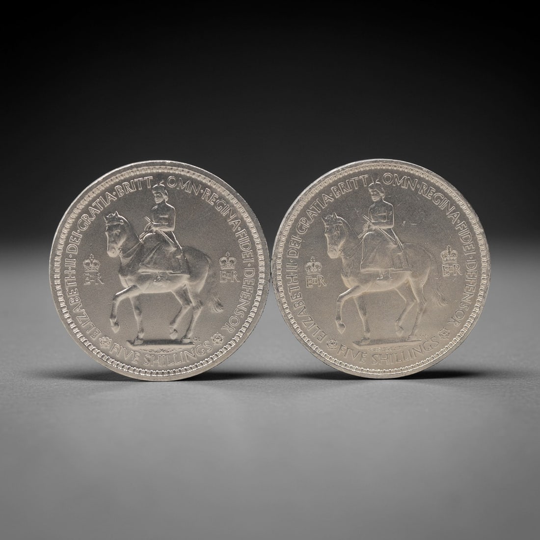 GREAT BRITAIN: Elizabeth II Five Shillings (Crown) Coin Pair, 1953, 38mm, 33ZJ: This matched pair of 1953 Five Shillings coins marks the coronation of Queen Elizabeth II, a pivotal moment that united post-war Britain and inaugurated the second Elizabethan era. The obverse of each