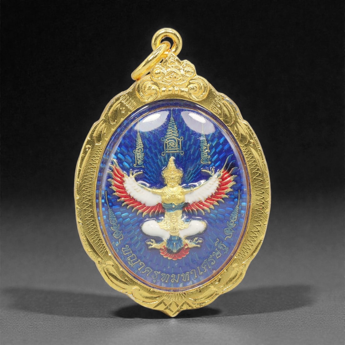 A Thai Gilt-Metal and Enamel Garuda Amulet with Gilt-Metal Frame, 21st Century, 77FP (1 of 2)