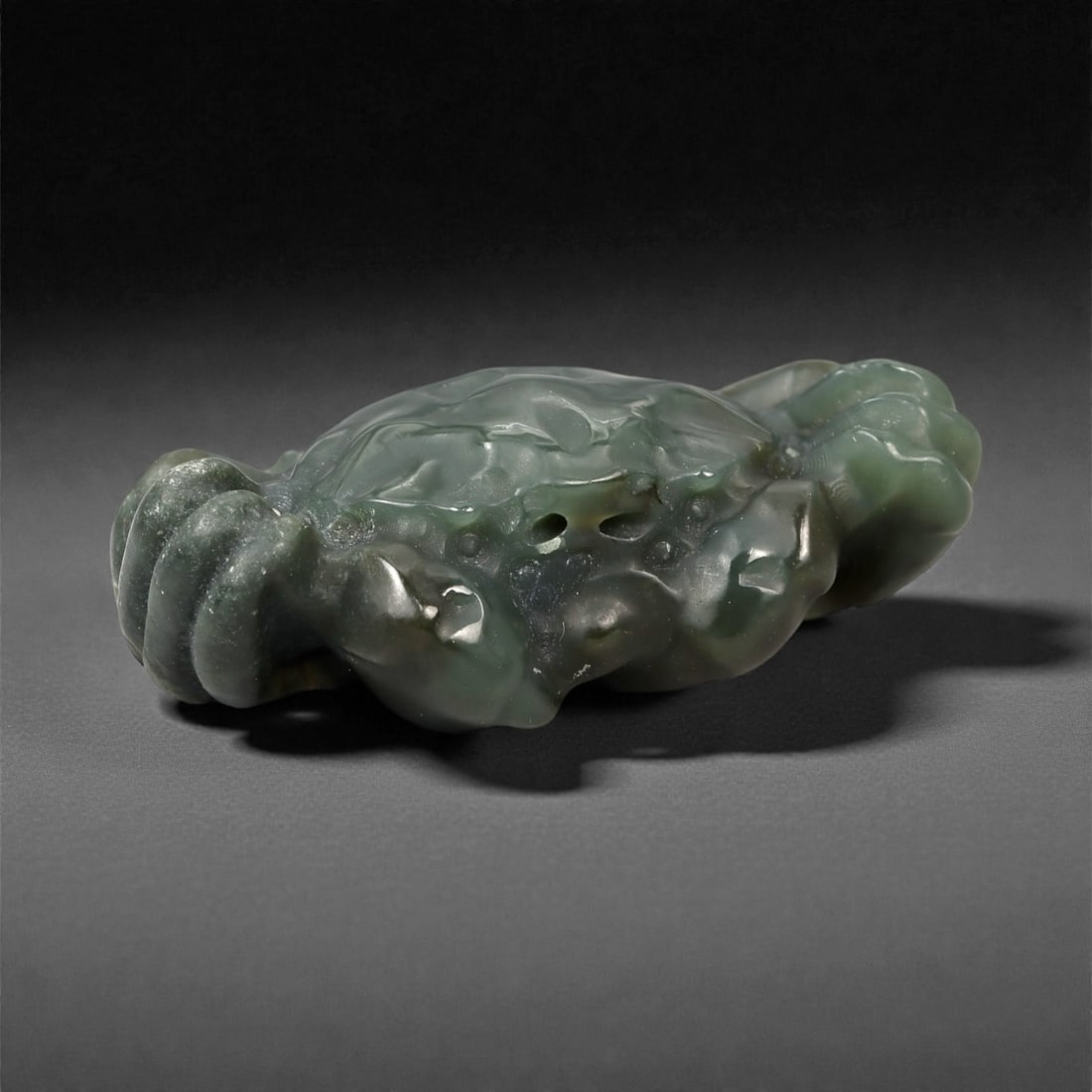 Chinese Jade Crab - Carved Animal Figurine 5.2cm, 85ZC: Carved from green jade with areas of soft translucency and darker natural inclusions, this compact sculpture is worked in the round to represent a crab. The form is modeled with a broad domed carapace