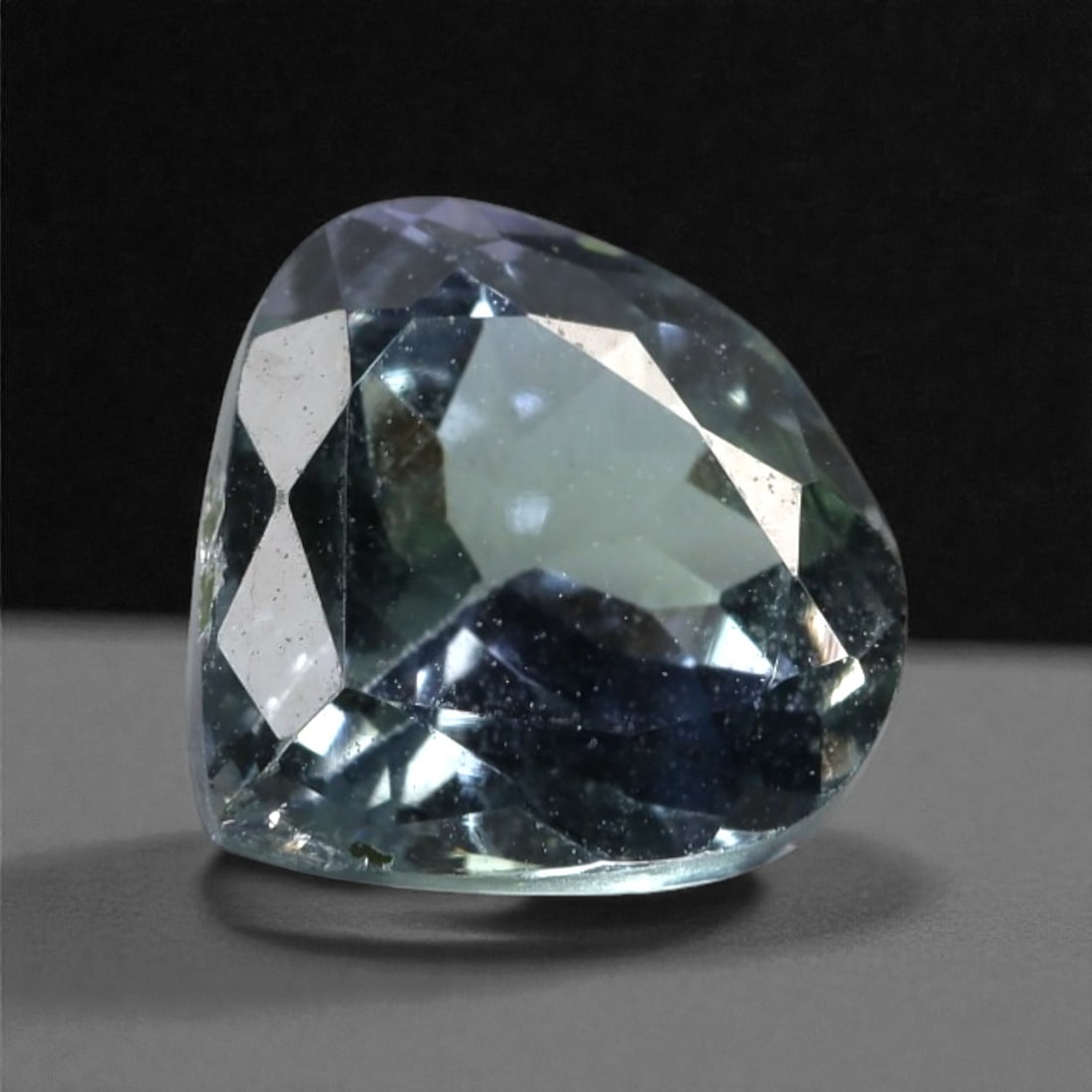 2.44 Carats Violet Blue Tanzanian Tanzanite Cushion Cut - 8.5 x 8.2 x 5.1 mm, 56XK: This well-proportioned tanzanite displays a cool violet blue tone with subtle shifts toward lavender and slate blue as light moves across the crown. The cushion cut emphasizes broad, calm reflections,