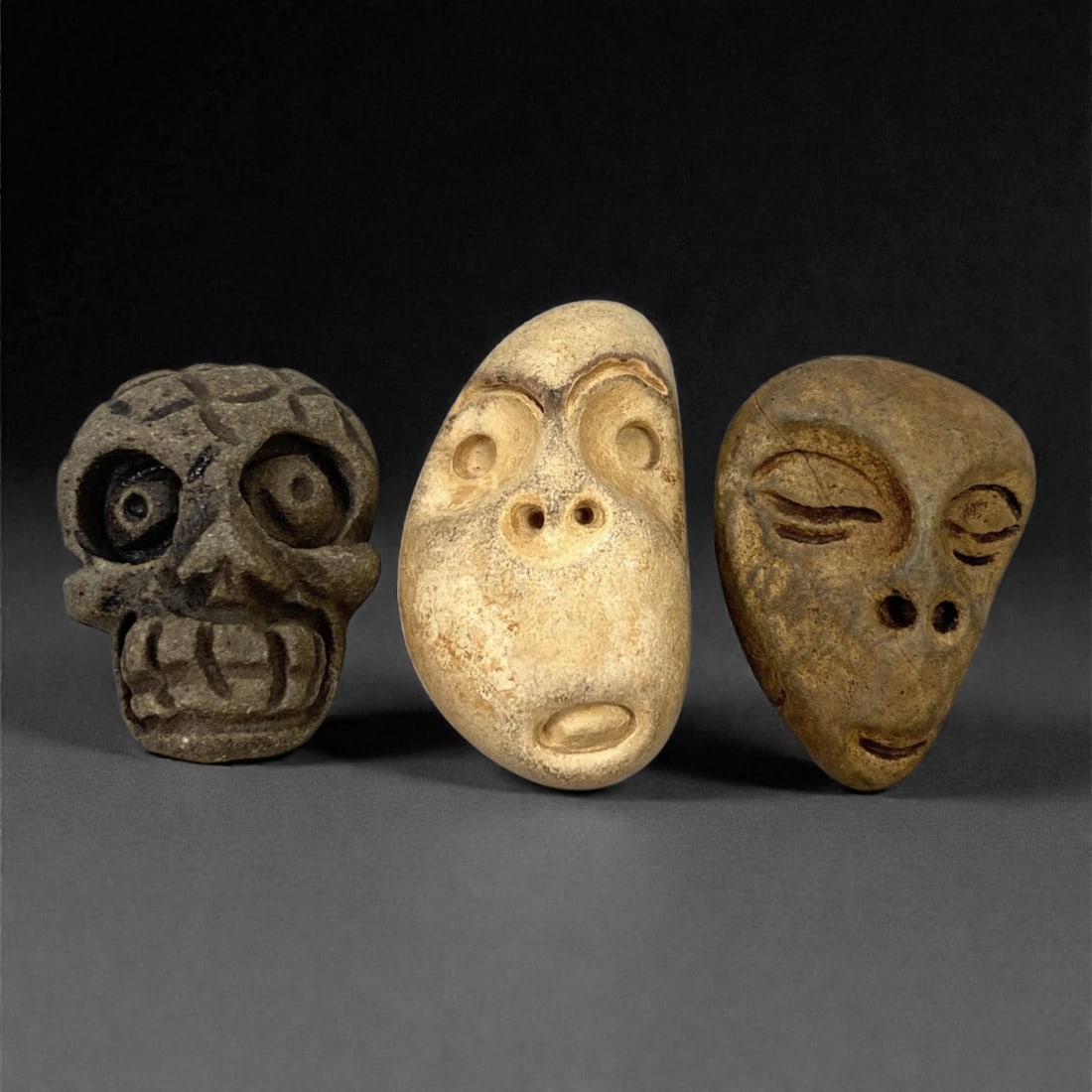 A Group of Three Medieval Stone Maskette Amulets, 10th-14th Century, 60FP (1 of 1)