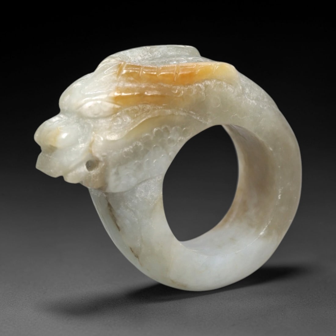 A Chinese Jadeite Jade Dragon-Form Ring, Qing Dynasty, 26FR (1 of 2)