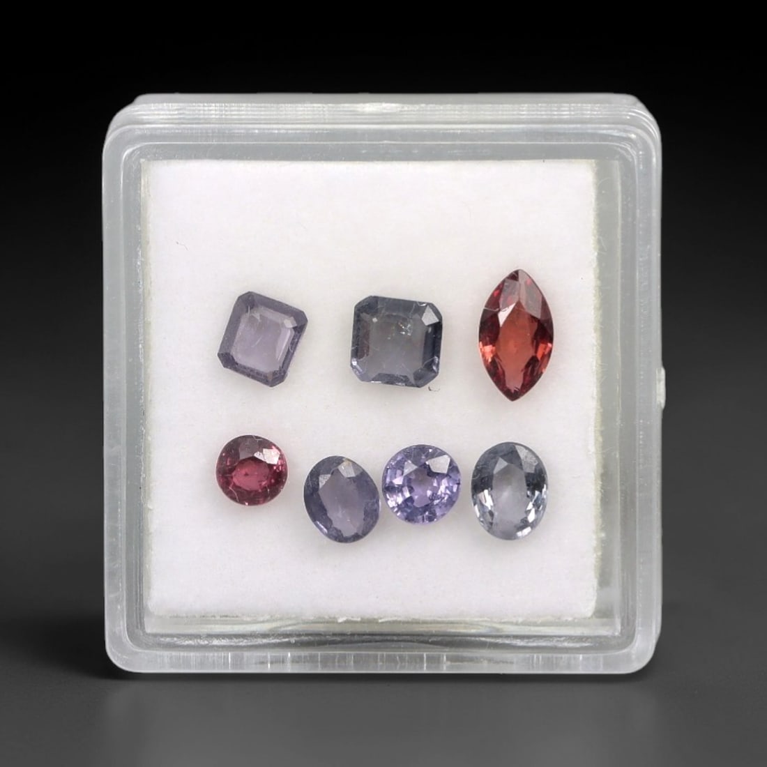 2.17 Carats Mixed-Cut Multi-Color Spinel Parcel - Natural Spinel 6x3mm, 67XM: This parcel of mixed-cut spinels showcases a captivating spectrum of colors, from deep red and rich pink to cool lavender, pale purple, and silvery-gray. Each stone is expertly faceted to maximize its
