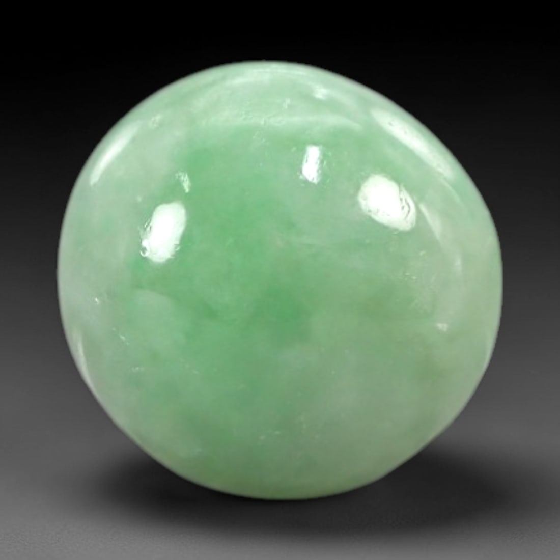 3.51 Carats Fresh Spring Green Burmese Jadeite Jade Cabochon - Natural Loose Gemstone, 46AC: This round Burmese jadeite jade cabochon features a fresh, lively spring green hue with a uniform, milky translucency that gives it a soft, glistening luster. Its full, rounded dome maximizes light di