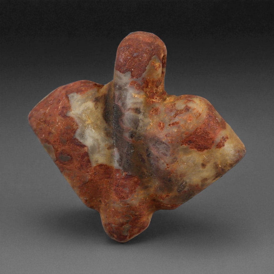 Ancient Egyptian Jasper Fly Amulet, c. 18th Dynasty, New Kingdom, 68XC: This finely carved jasper amulet, depicting a stylized fly, dates to Egypt's New Kingdom, around the 15th-14th centuries BCE, a period renowned for artistic refinement and symbolic complexity. The fly