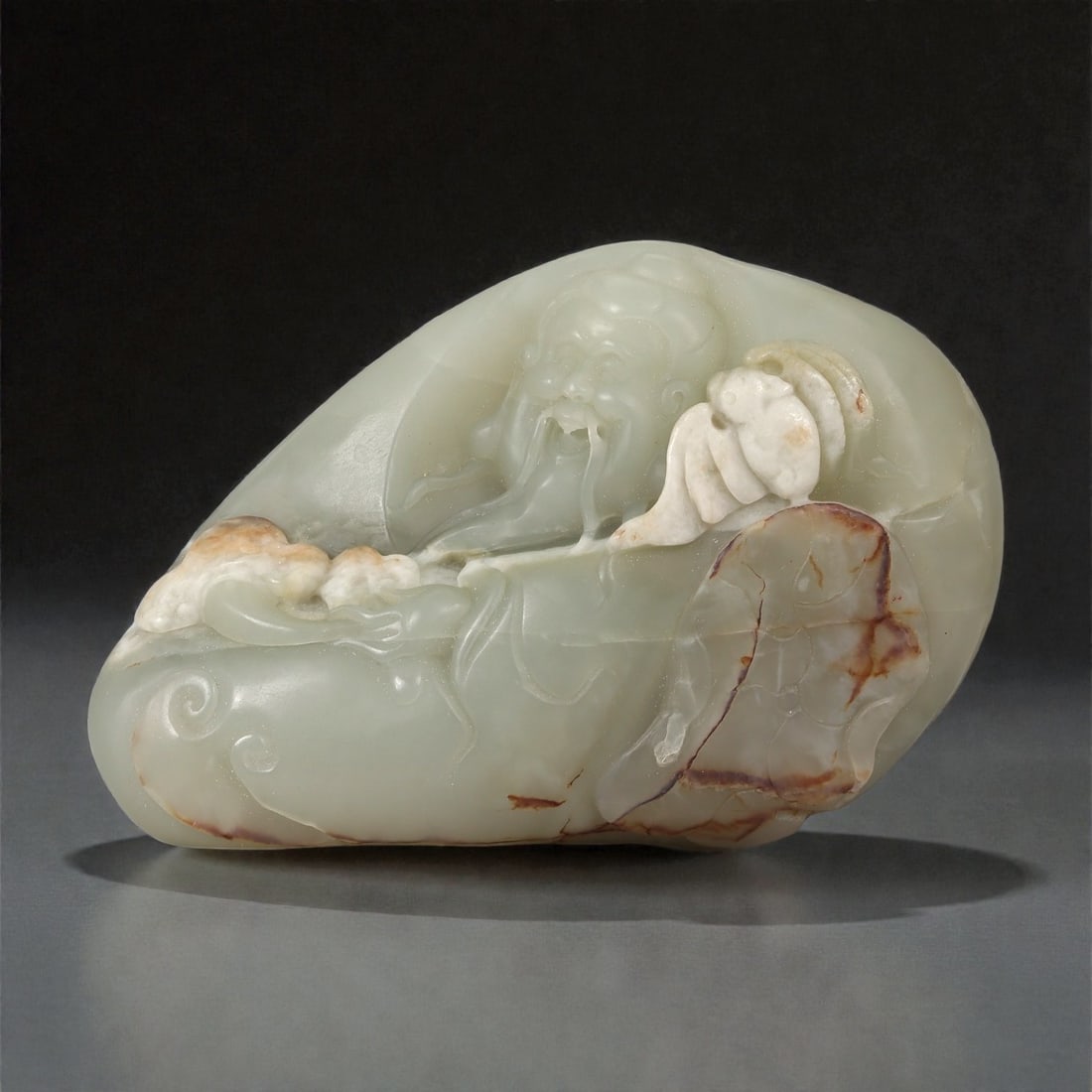 A Chinese Hetian Jade Pebble Carving with Scholar and Landscape Motifs, 20th Century, 14FD (1 of 2)