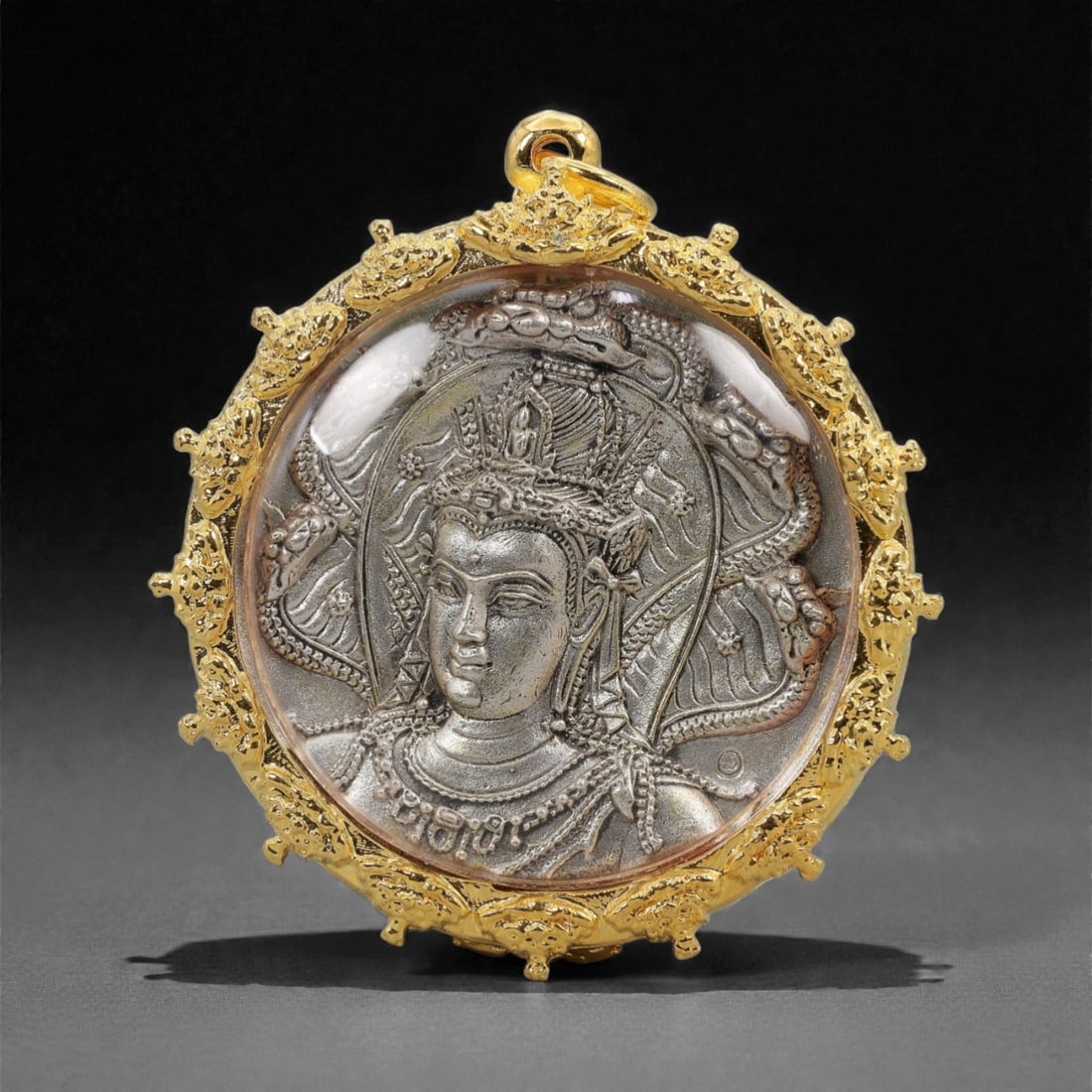 A Thai Buddhist Silvered Metal Amulet in Gilt Metal Frame, 20th Century, 63FN (1 of 2)