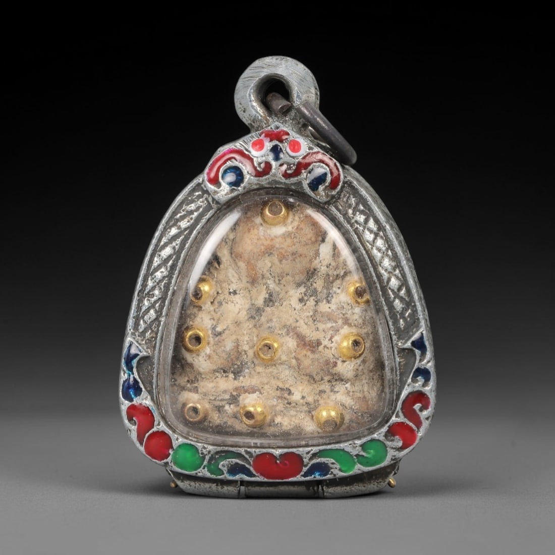 A Thai Sacred Relic Amulet in an Enameled Silver Frame, 20th Century, 85FT (1 of 2)