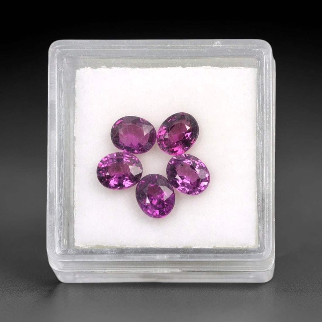3.10 Carats Oval Mixed-Cut Grape Garnet Parcel - Natural Garnet 5x4mm, 66XM: This parcel of oval mixed-cut grape garnets showcases a rich, deep purple hue with vibrant pink undertones, creating a luminous, velvety appearance. The expertly executed faceting enhances the gems' b