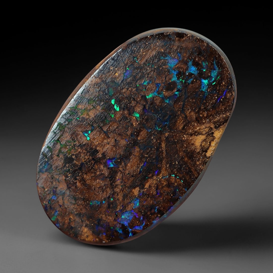 4.93 Carats Koroit Yowah Opal Cabochon - Natural Australian Single Stone, 68XL: This substantial Koroit Yowah opal cabochon, measuring 13.4x8.6mm, features a dense, textured ironstone matrix in layered tones of deep chocolate brown, warm tan, and jet black. The stone's internal l