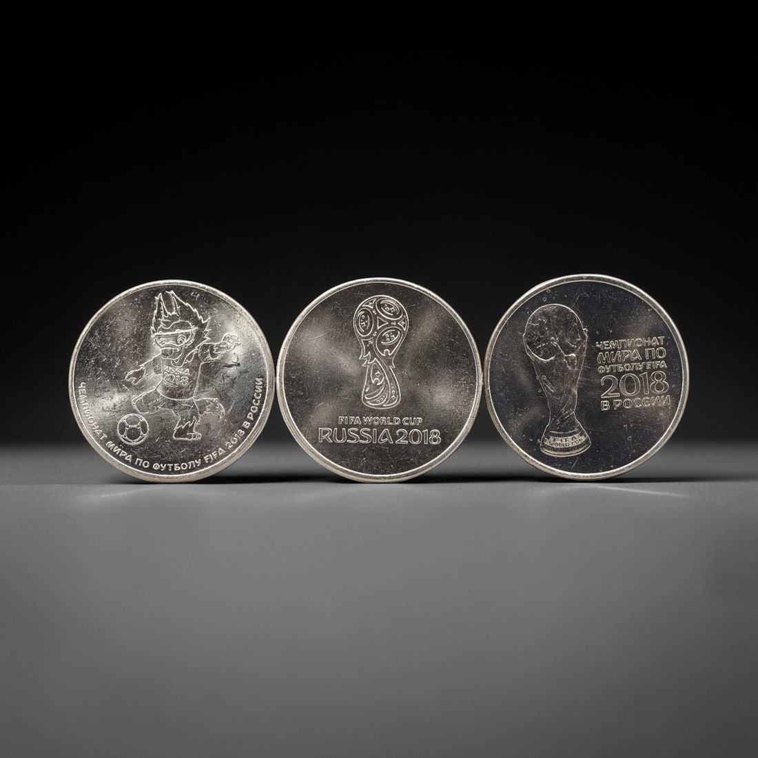 RUSSIA: FIFA World Cup - 25 Roubles Commemorative Coin Set, 2018, 27mm, 4ZJ: This three-coin set was issued by the Bank of Russia in 2018 to commemorate the FIFA World Cup, a global sporting event that united nations through the universal language of football. The obverse of e