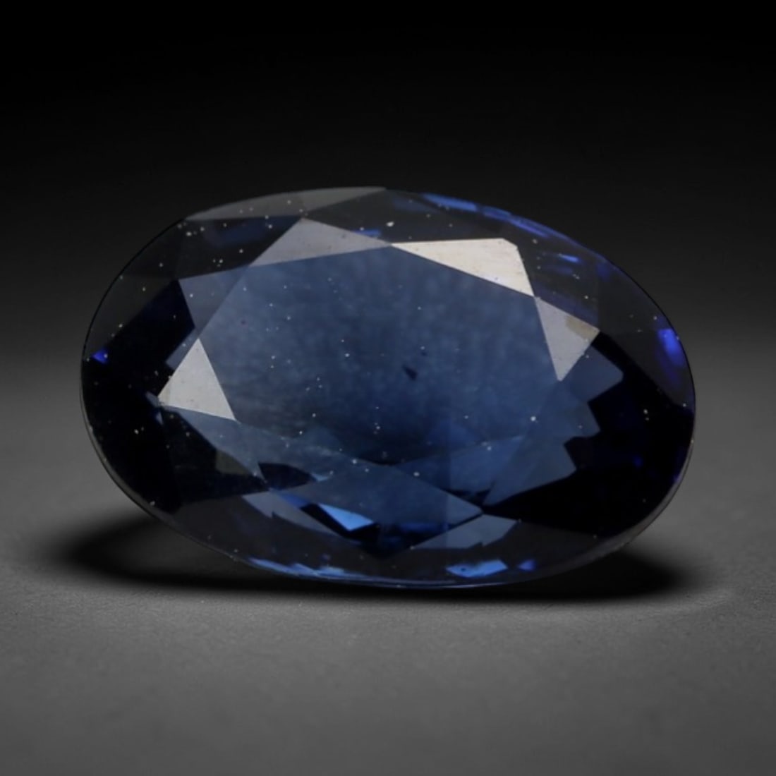 1.094 Carats Blue Sapphire - Natural Sri Lankan (Ceylon) Gemstone, LZ276: This refined oval mixed-cut sapphire exudes a deep, velvety blue hue, evoking the calm intensity of a twilight ocean under a clear Ceylon sky. The mixed faceting is expertly proportioned to maximize l