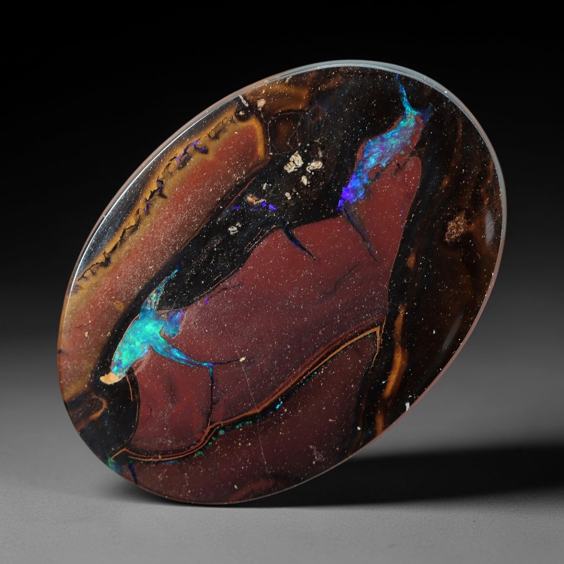 11.58 Carats Koroit Yowah Opal Cabochon - Natural Australian Single Stone, 85XL: This substantial Koroit Yowah opal cabochon, measuring 18x12.8mm, features a dramatic composition of deep plum and black ironstone matrix, interwoven with bold veins of iridescent opal. The opal inclu