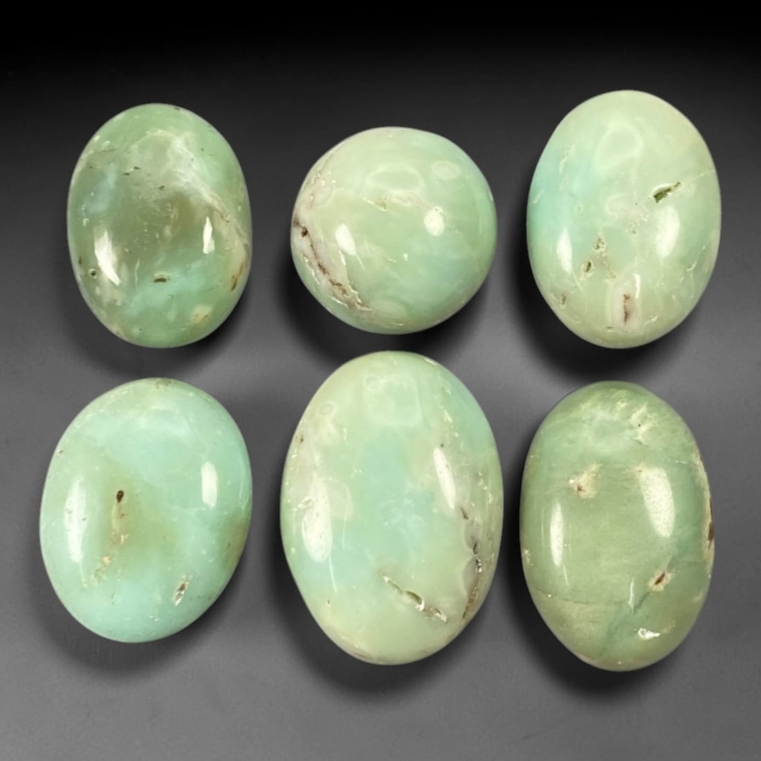 139.68 Carats Seafoam Green Chrysoprase Cabochon Parcel - Natural Australian Stones, 94ZL: This substantial parcel of chrysoprase cabochons, weighing an impressive total of 139.68 carats with individual dimensions ranging from 1.7 to 2.7 cm, presents a serene palette of seafoam green hues.