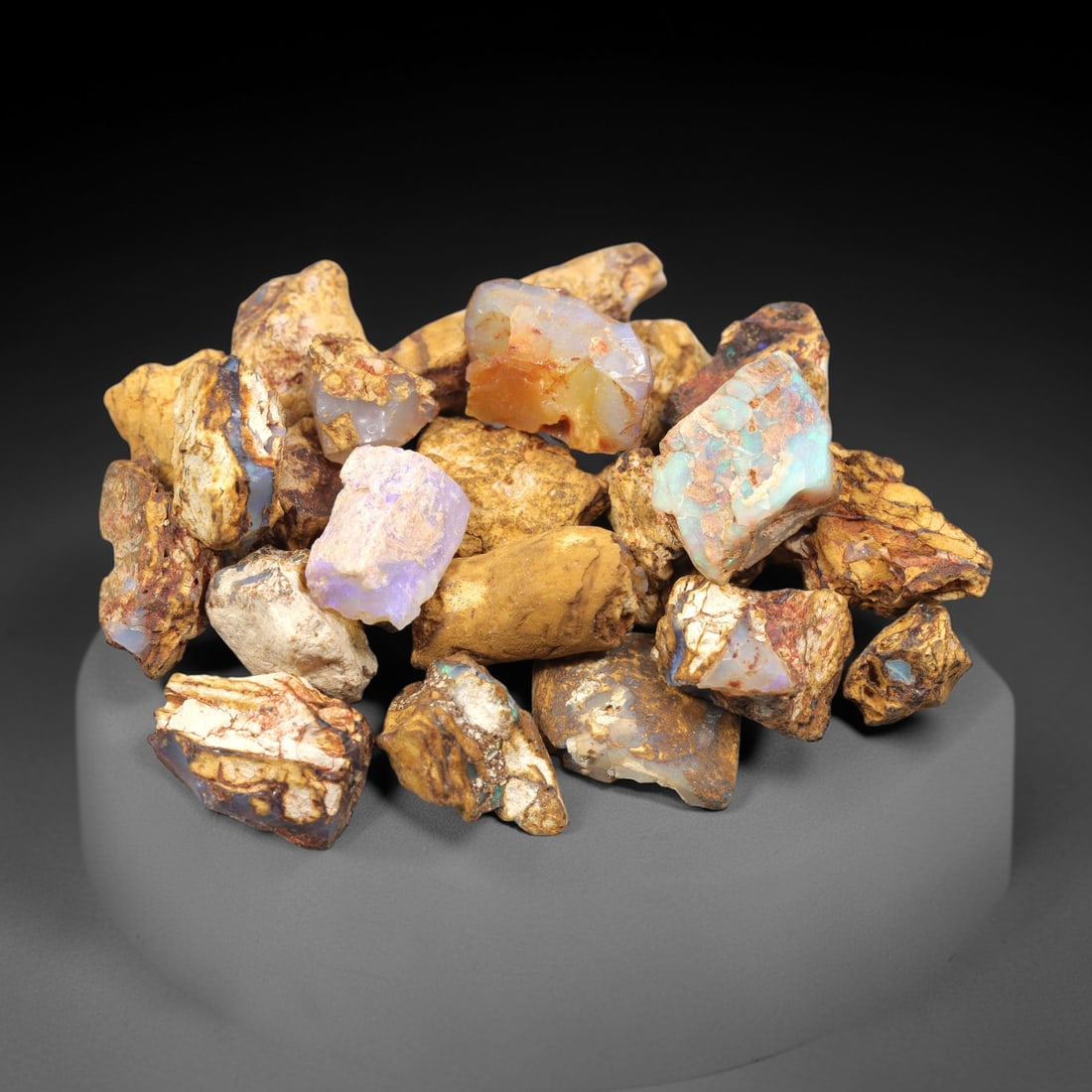 A Lot of Boulder Opal Rough Specimens, 64ZJ: This lot consists of multiple boulder opal rough specimens, with individual sizes ranging from 1 to 2.3 cm and a total weight of 35.54 grams. Each specimen retains its natural ironstone host rock matr