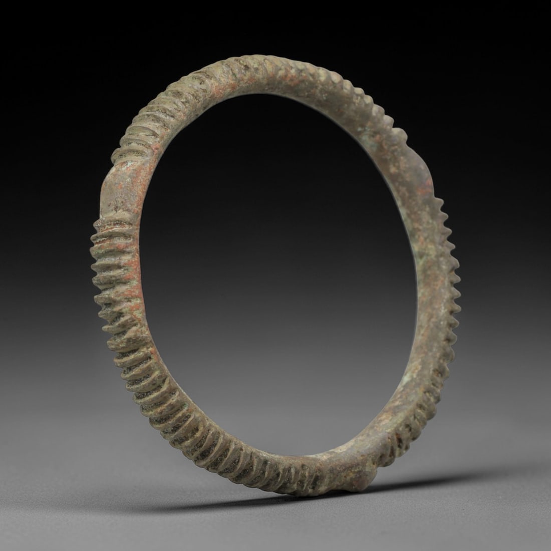 A Roman Bronze Ribbed Bracelet, 1st-3rd Century CE, 100FT (1 of 2)