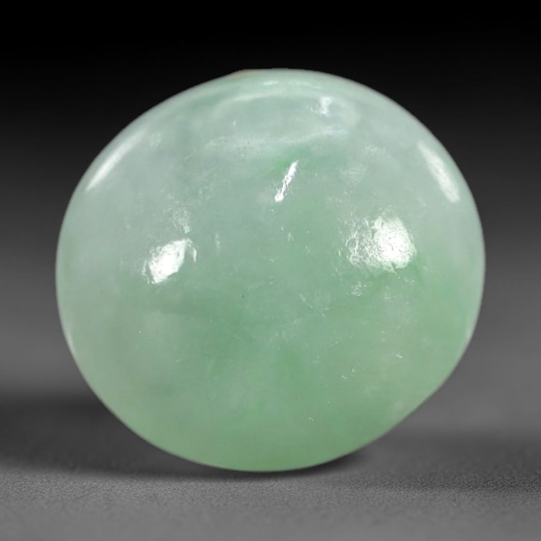 3.19 Carats Apple Green Burmese Jadeite Jade Cabochon - Natural Loose Gemstone, 75XN: This singular Burmese jadeite jade cabochon presents a luminous apple green hue, soft and luminous with a translucent quality that allows light to filter gently through its smooth, domed surface. The