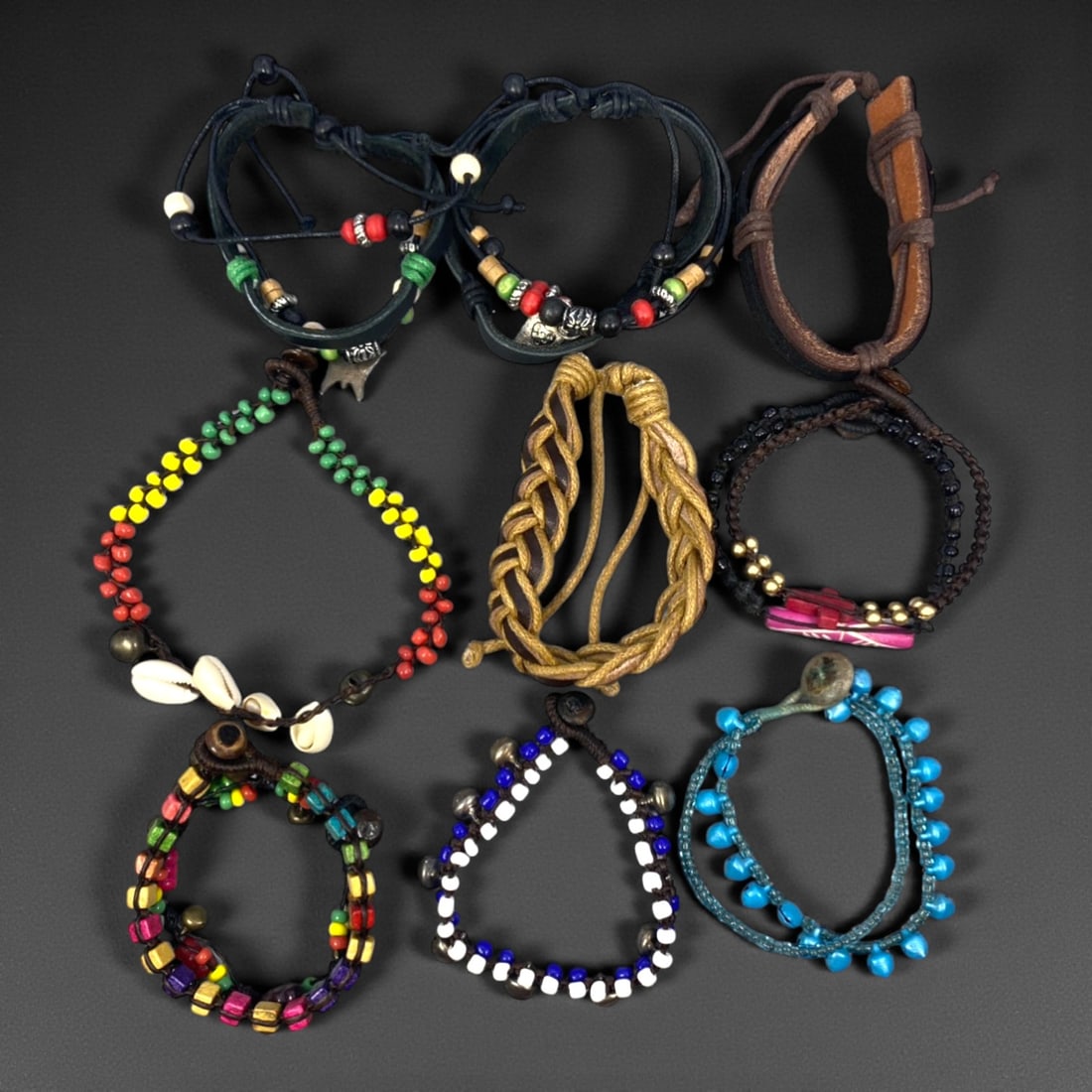 A Group of Eleven Leather and Beaded Bracelets, Late 20th-Early 21st Century, 34ZG: The group comprises eleven bracelets constructed from leather cords, braided fibers, and assorted beads, forming a varied assemblage of casual decorative jewelry. The designs include wrapped and braid
