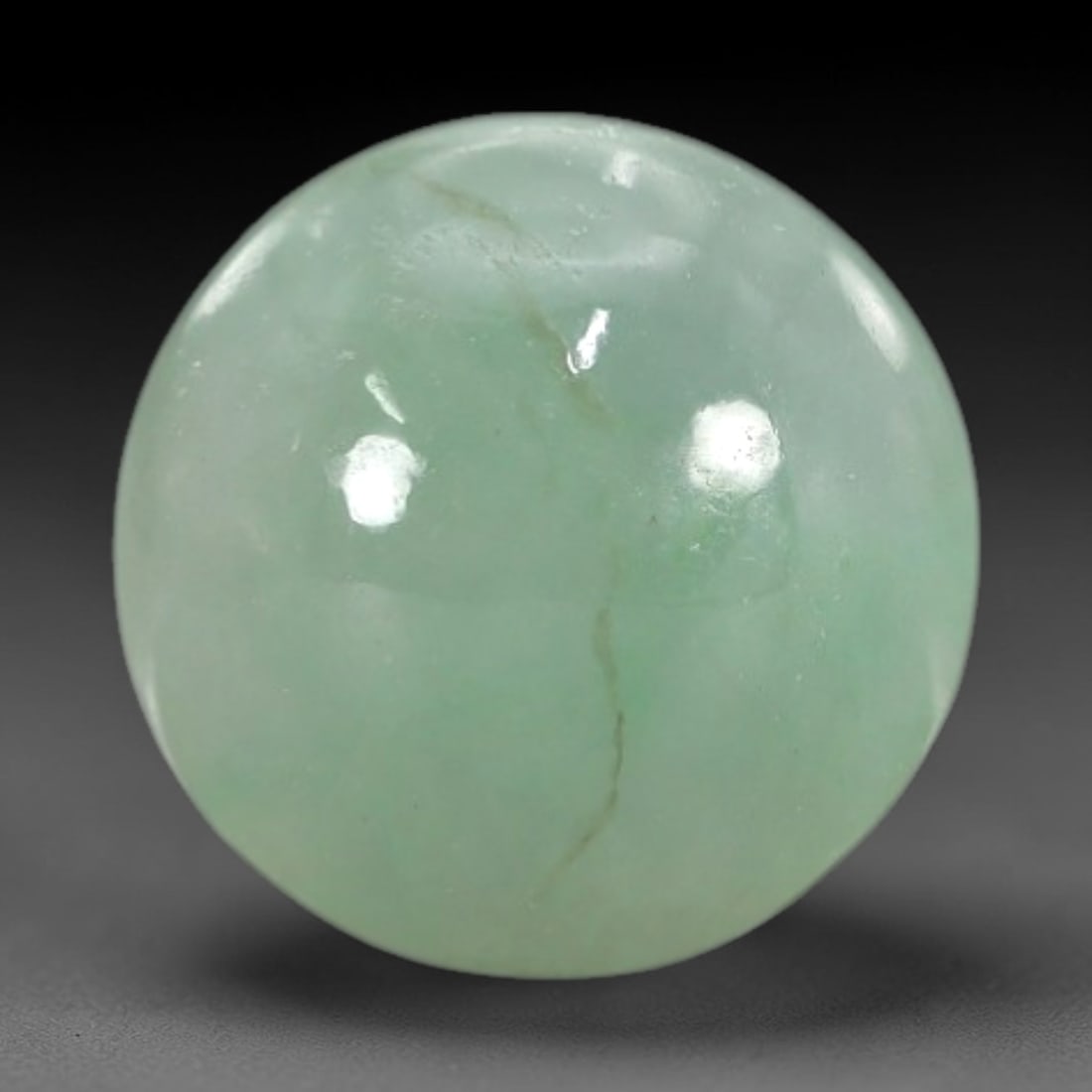 3.34 Carats Apple Green Burmese Jadeite Jade Cabochon - Natural Loose Gemstone, 76XN: This singular Burmese jadeite jade cabochon presents a luminous apple green hue, soft and luminous with a translucent quality that allows light to filter gently through its smooth, domed surface. The