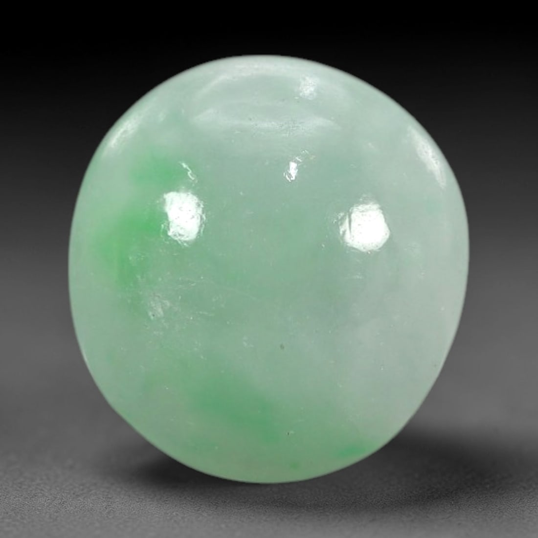 3.24 Carats Apple Green Burmese Jadeite Jade Cabochon - Natural Loose Gemstone, 77XN: This singular Burmese jadeite jade cabochon presents a luminous apple green hue, soft and luminous with a translucent quality that allows light to filter gently through its smooth, domed surface. The