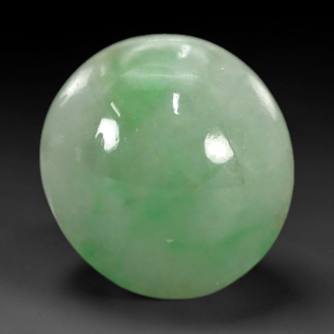 2.49 Carats Apple Green Burmese Jadeite Jade Cabochon - Natural Loose Gemstone, 69XN: This singular Burmese jadeite jade cabochon presents a luminous apple green hue, soft and luminous with a translucent quality that allows light to filter gently through its smooth, domed surface. The