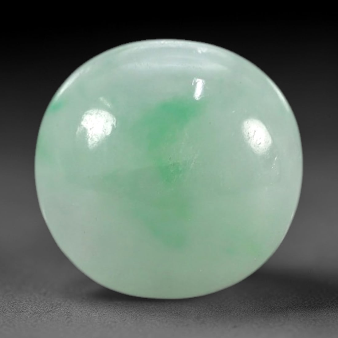 2.55 Carats Apple Green Burmese Jadeite Jade Cabochon - Natural Loose Gemstone, 41XN: This singular Burmese jadeite jade cabochon presents a luminous apple green hue, soft and luminous with a translucent quality that allows light to filter gently through its smooth, domed surface. The