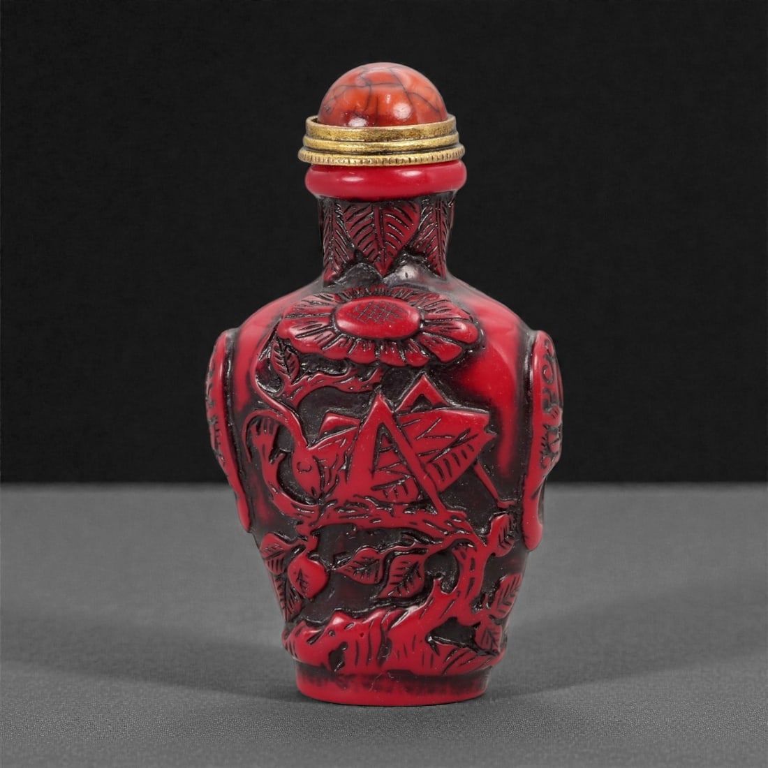 A Chinese Carved Red Material Snuff Bottle, 20th Century, 16FG (1 of 2)
