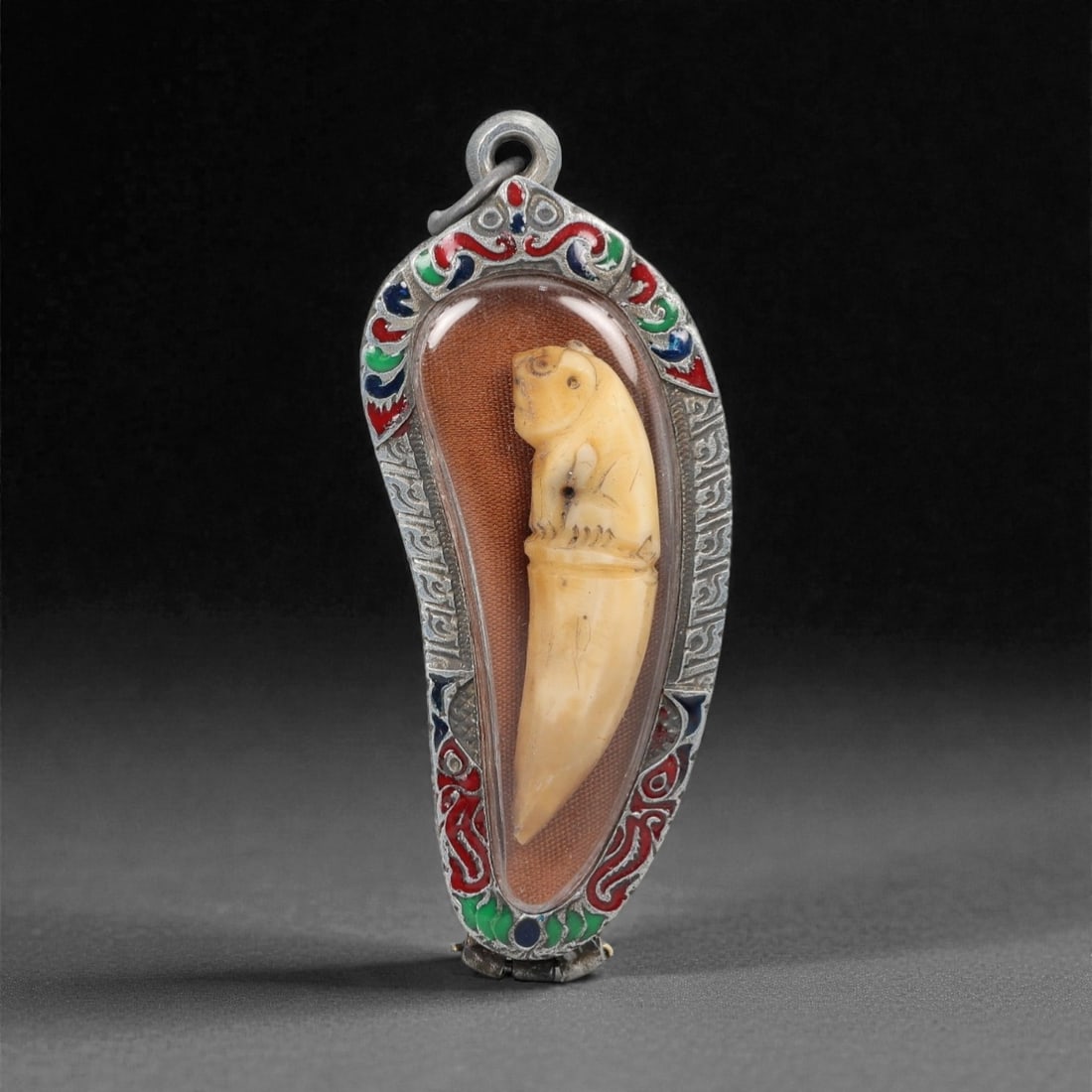 A Thai Carved Fang Amulet, 20th Century, 50FN (1 of 2)