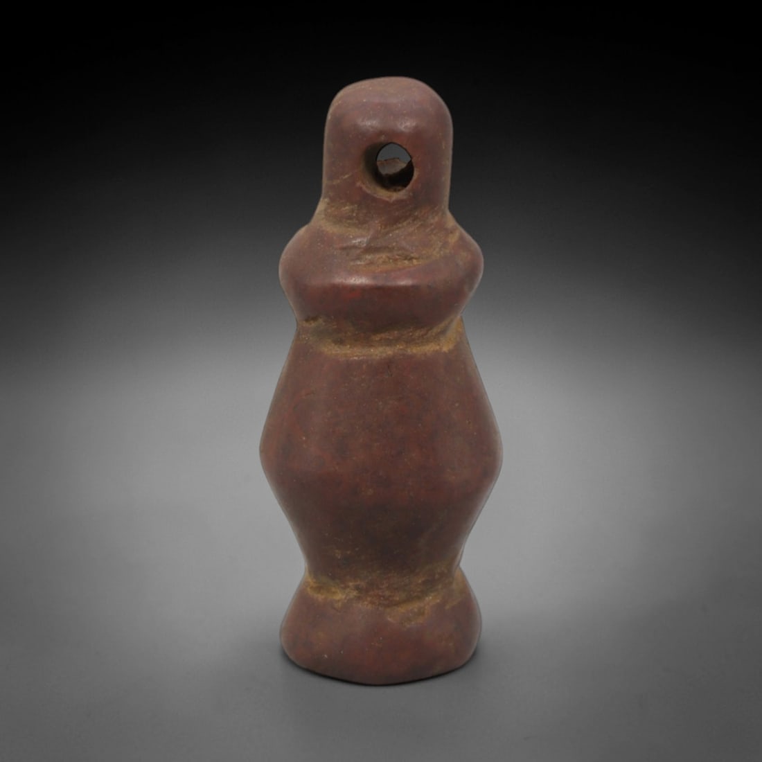 Ancient Red Stone Vessel-Form Pendant - Near Eastern Ritual Amulet, 20XQ: Carved from a rich, earthy red stone with natural mineral inclusions, this miniature pendant takes the stylized form of a ritual vessel, a potent motif in ancient Near Eastern art associated with abun