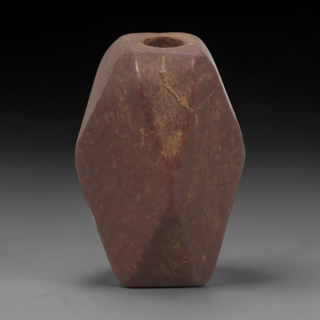 Ancient Red Stone Faceted Bead Pendant - Near Eastern Ritual Amulet, 19XQ: Carved from a rich, earthy red stone with natural mineral inclusions and visible ancient fissures, this miniature pendant is a faceted bead form, a distinctive geometric motif in ancient Near Eastern