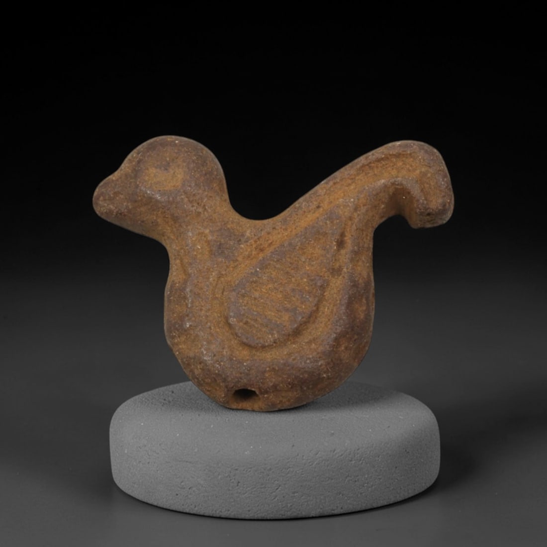 Ancient Brown Stone Bird-Form Amulet - Near Eastern Miniature Figurine, 18XQ: Carved from a rich, earthy brown stone with natural mineral patination, this charming amulet depicts a stylized bird, a beloved motif in ancient Near Eastern ritual art associated with freedom, spirit