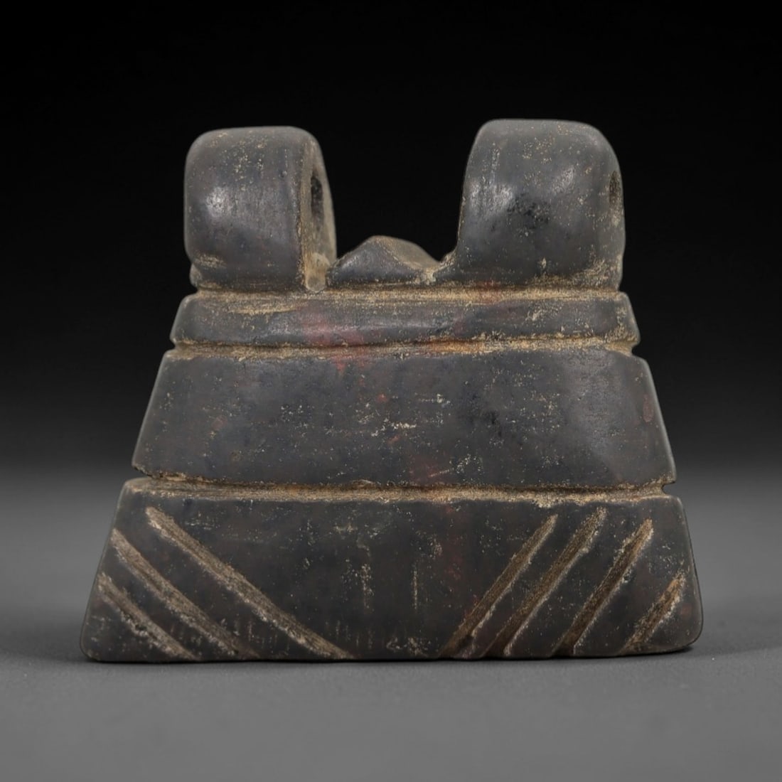 Ancient Egyptian Stone Amulet - Geometric Carved Pendant, 24AE: Carved from dark stone, this ancient Egyptian amulet features a trapezoidal form with incised geometric detailing, a motif typical of Egyptian protective amulets. Craftsmanship is simple yet deliberat