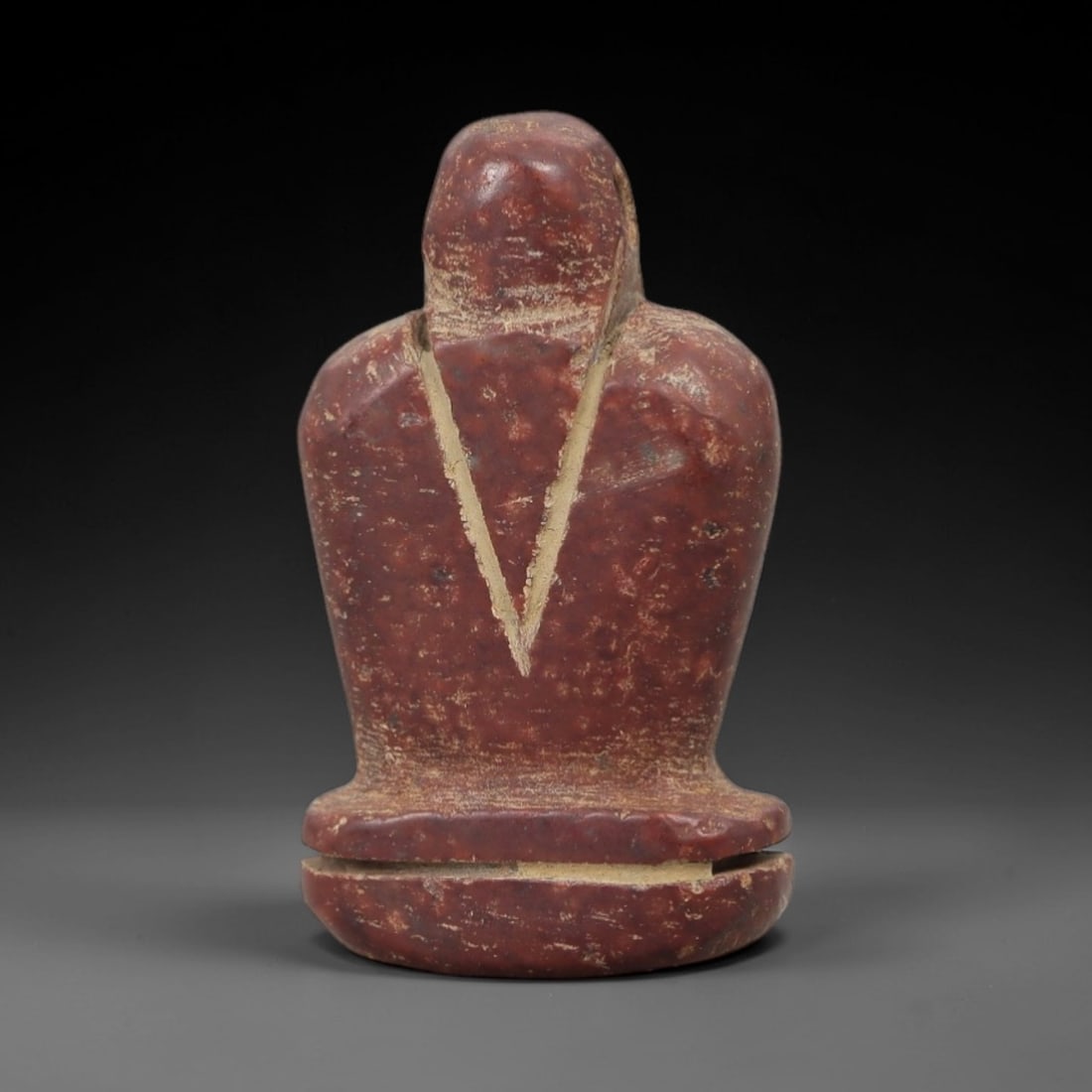 Ancient Red Stone Anthropomorphic Idol - Near Eastern Figurine, 41AE: This artifact is a carved red stone anthropomorphic idol of Near Eastern origin, crafted from a rich terracotta-hued stone with natural mineral inclusions and earthy patination. Its stylized form feat