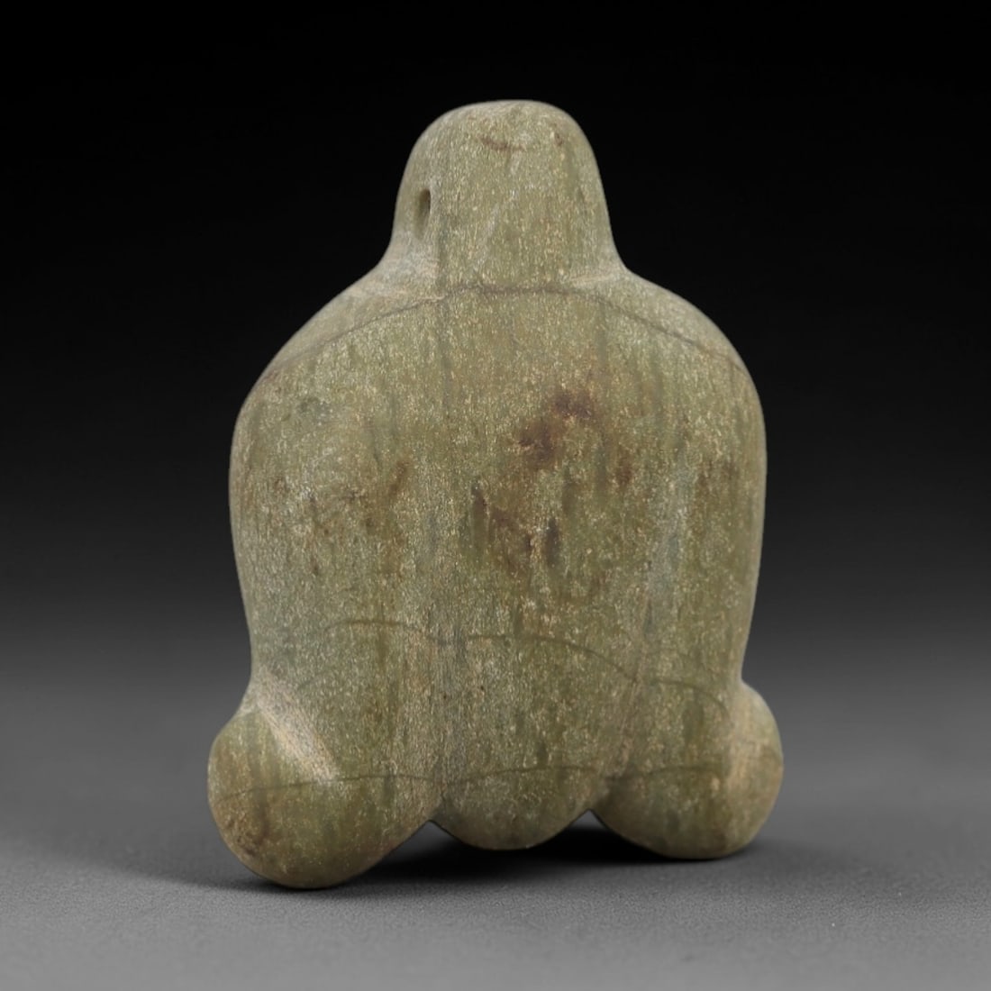 Ancient Green Stone Anthropomorphic Idol - Near Eastern Figurine, 19AE: This artifact is a carved green stone anthropomorphic idol of Near Eastern origin, crafted from a mottled olive-green stone with natural mineral veining and earthy patination. Its abstract form consis