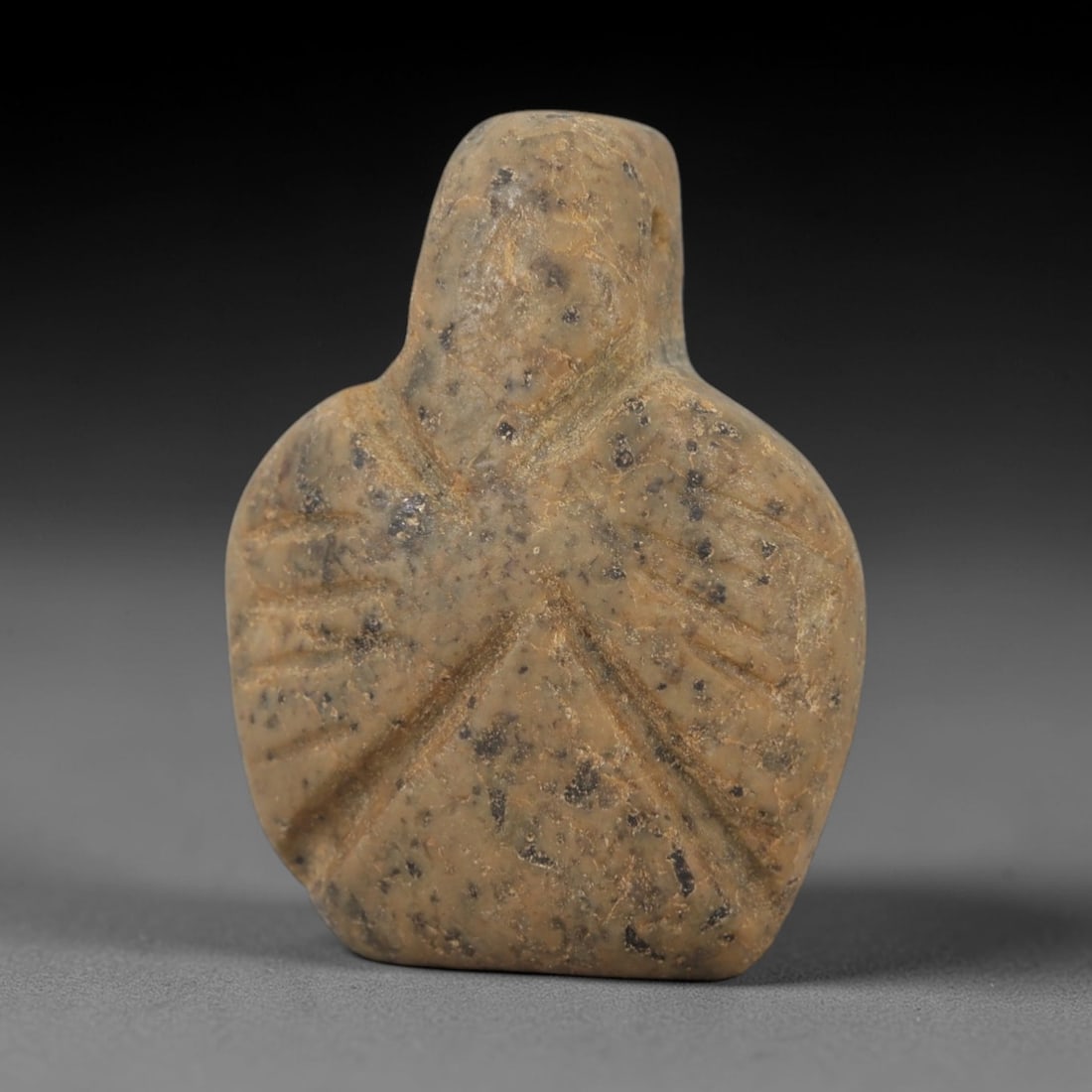 Ancient Egyptian Stone Amulet - Carved Ritual Figurine, 91AE: Carved from greyish-brown stone, this amulet features a stylized anthropomorphic form with incised linear detailing, consistent with ancient Egyptian ritual amulets of the Late Period. The piece has a