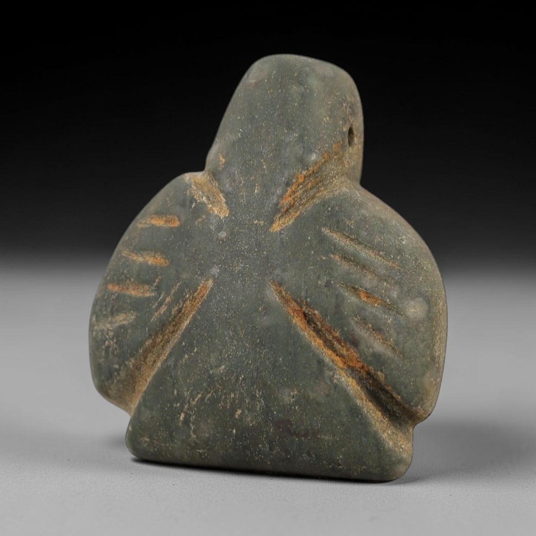 Ancient Egyptian Stone Amulet - Carved Ritual Figurine, 80AE: Carved from greyish-brown stone, this amulet features a stylized anthropomorphic form with incised linear detailing, consistent with ancient Egyptian ritual amulets of the Late Period. The piece has a