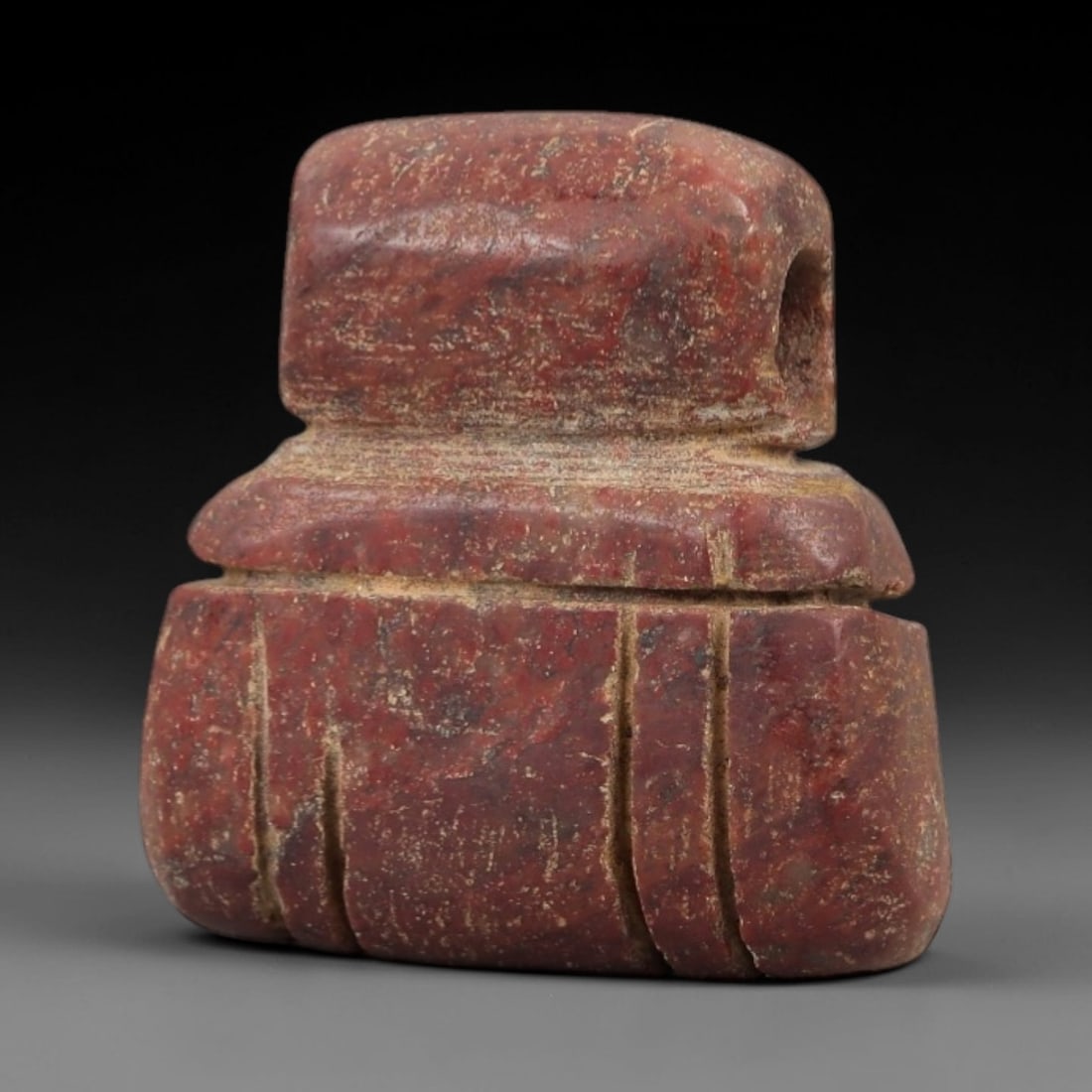 Ancient Egyptian Stone Amulet - Geometric Carved Pendant, 79AE: Carved from stone, this ancient Egyptian amulet features a geometric pattern with linear carvings, a design typical of protective amulets from the Late Period. The compact pendant has a suspension hol