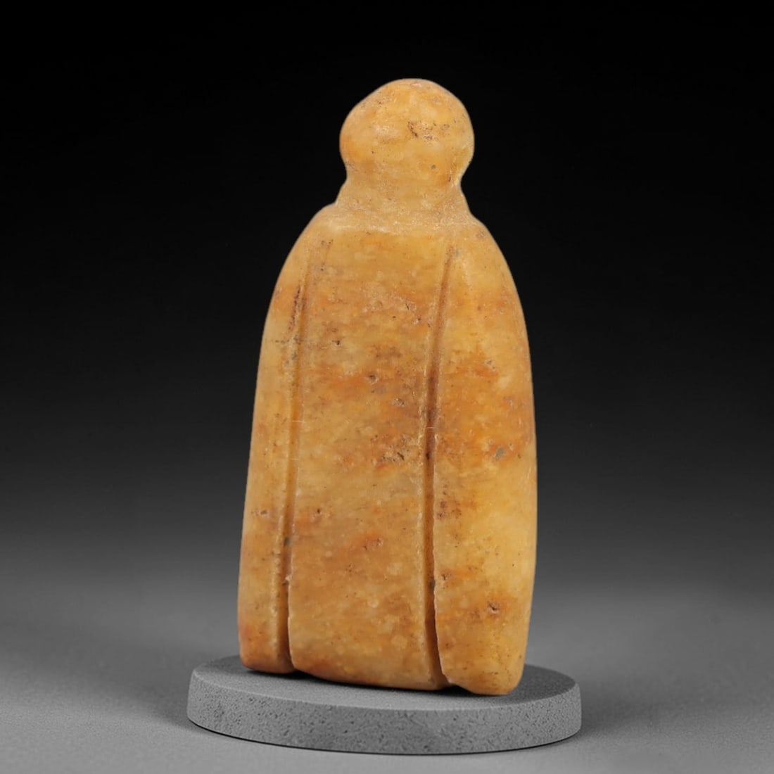 Ancient Egyptian Stone Amulet - Anthropomorphic Carved Pendant, 89AE: Carved from stone, this ancient Egyptian anthropomorphic amulet features a stylized human form with linear decorative patterns, characteristic of protective amulet designs from the Late Period. The co