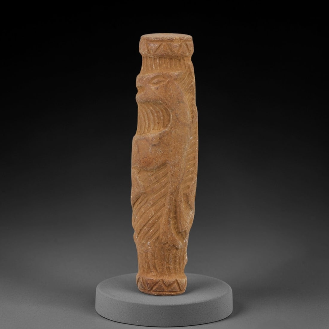 Ancient Limestone Cylinder Bead - Carved Relief Figurine, 58AH: Carved from limestone, this ancient cylinder bead features a slender, tubular form with raised relief detailing depicting a stylized humanoid figure, typical of ornamental use in early cultural contex