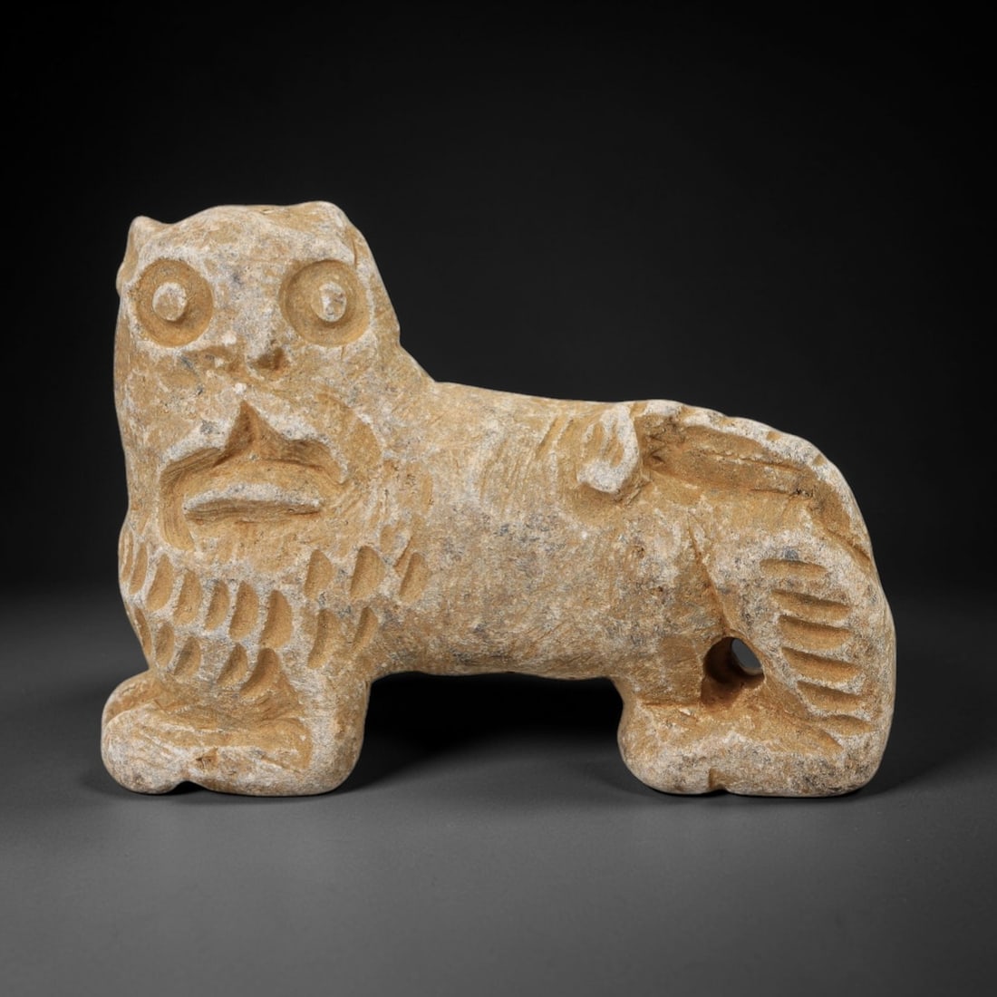 Ancient Stone Lion Figurine - Near Eastern Amulet, 43AH: Carved from stone, this ancient Near Eastern lion figurine features a stylized facial rendering with distinct eye and mane details, crafted in the primitive yet expressive style typical of regional am