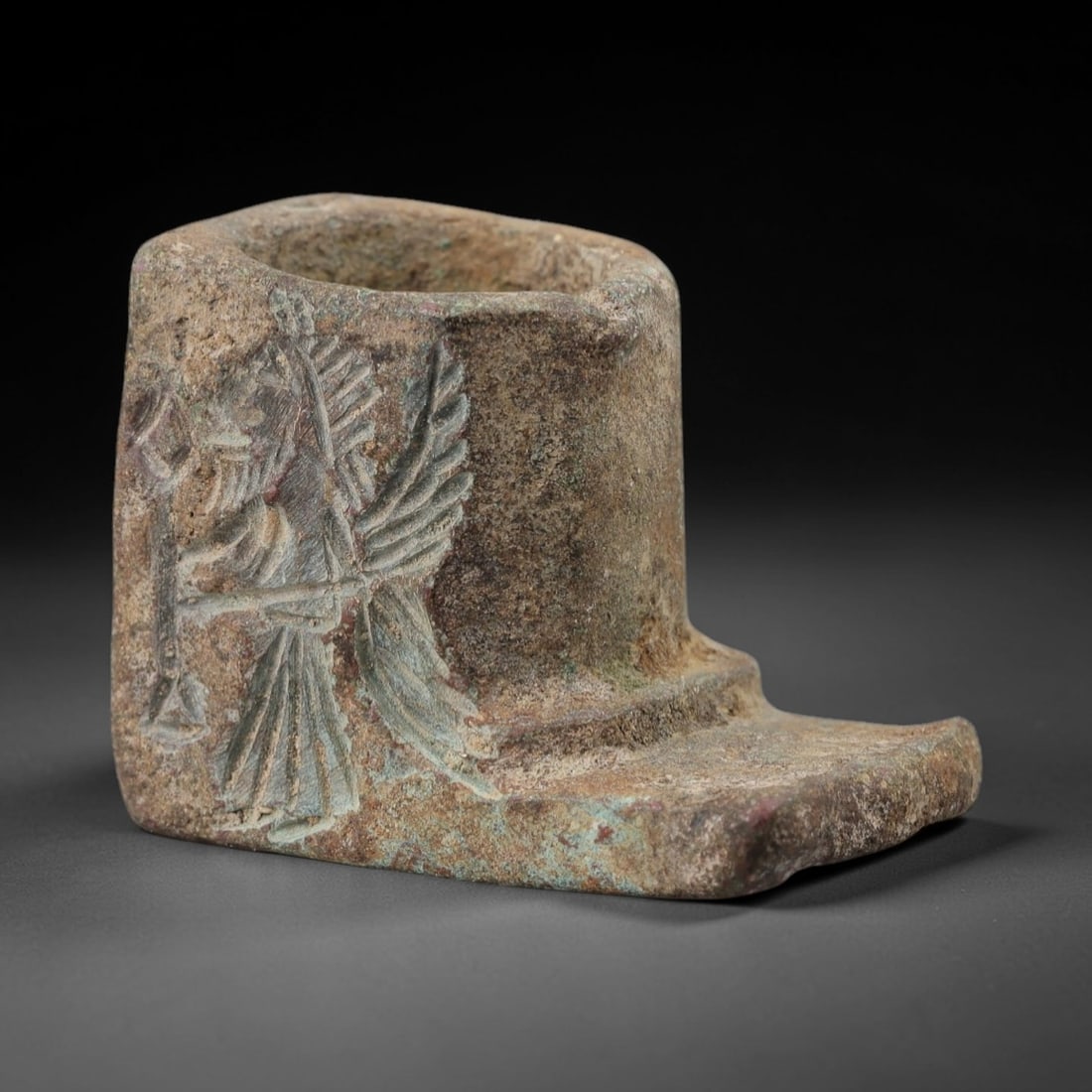 Ancient Bronze Relic - Miniature Winged Figurine, 30AH: Crafted from bronze, this ancient miniature relic features a winged humanoid figure with detailed incised detailing, likely serving a ritual or symbolic function in an early cultural context. The meta