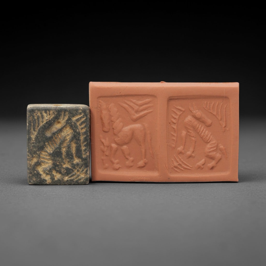 Ancient Stone Amulet - Near Eastern Stamp Seal Figurine, 4AH: Carved from stone, this ancient Near Eastern double convex stamp seal amulet features stylized animal motifs typical of early glyptic art in the region. The piece exhibits primitive yet precise crafts