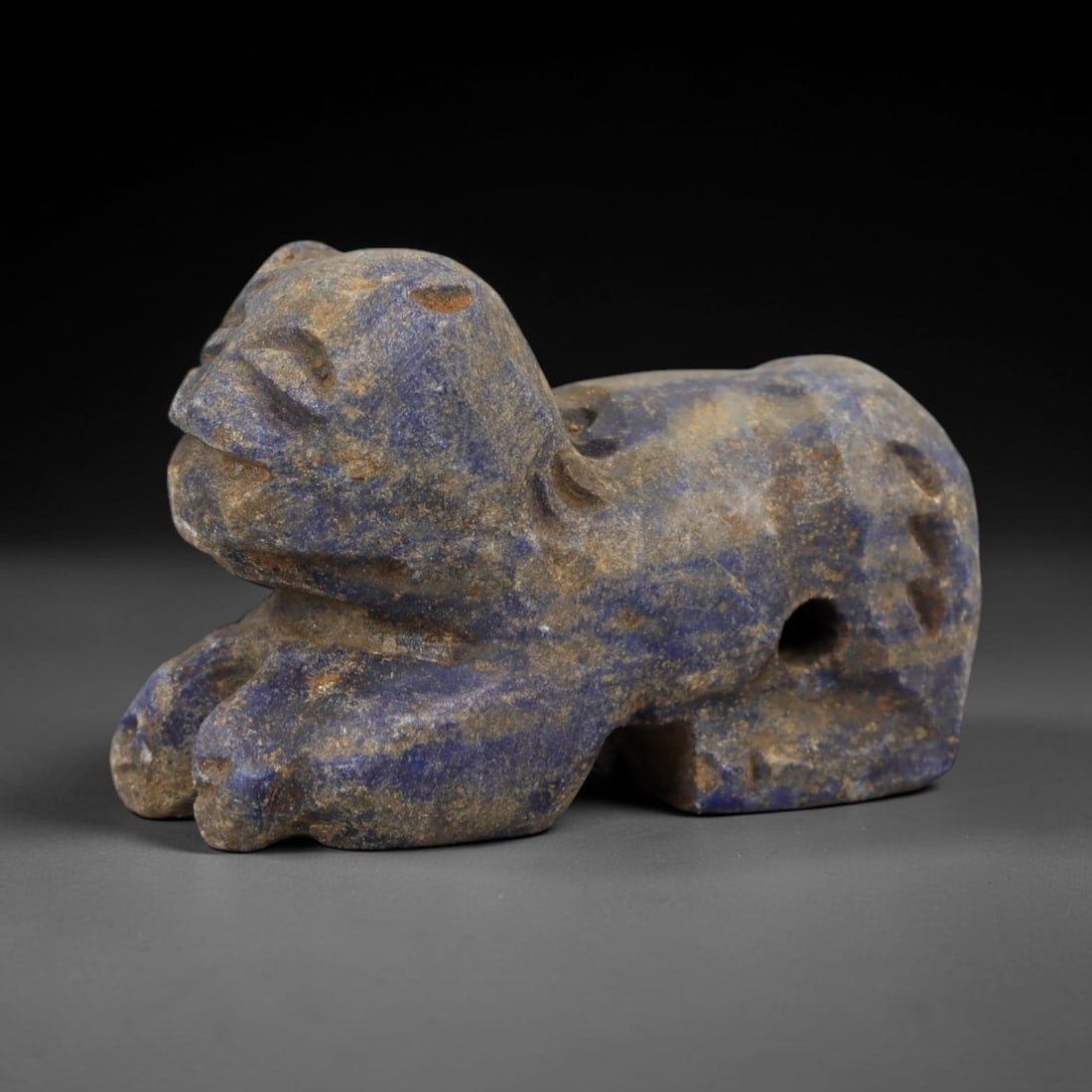 Ancient Schist Cub Zoomorphic Figurine - Animal Carving, 40AH: Carved from schist stone, this ancient cub zoomorphic figurine features a stylized animal form with incised detailing, typical of small-scale ornamental use in early cultural contexts. The stone exhib