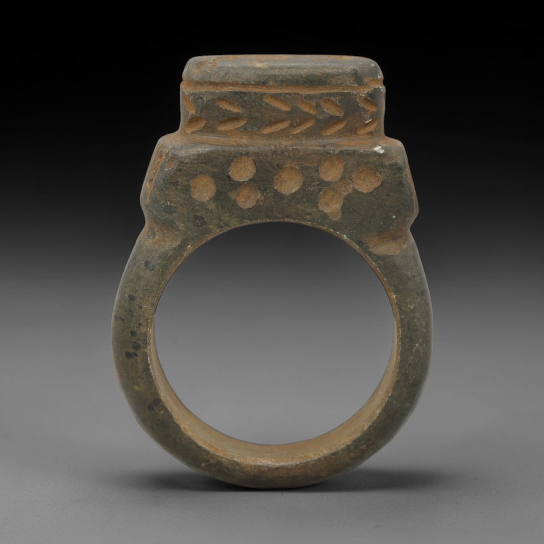 Ancient Steatite Intaglio Ring - Near Eastern Carved Signet Ring, 39ZQ: Carved from steatite, this ancient Near Eastern intaglio ring features a central intaglio panel with a stylized animal motif and linear detailing, typical of early glyptic art. The ring exhibits a smo