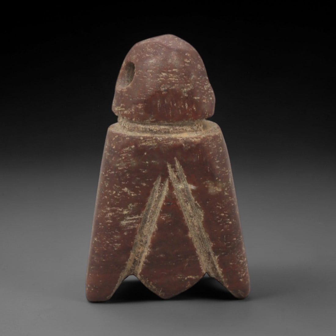 Ancient Stone Fly - Egyptian Amulet Pendant, 7XR: Carved from rich red stone, this amulet depicts a stylized fly with a domed head (featuring a suspension hole), narrow neck, and broad, wing-like lower body terminating in a split tail. The form and i