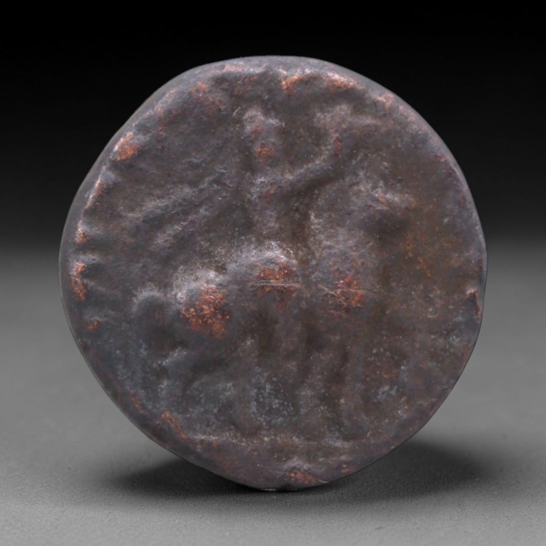 INDO-GREEK KINGDOMS: Hellenistic Legacy Bronze Coin, 2nd-1st Century BCE, 20mm, 6.59g, 6XS: This compact bronze coin from the Indo-Greek kingdoms is a vivid testament to the fusion of Hellenistic and South Asian cultures that shaped ancient Central Asia. The obverse depicts a mounted warrior